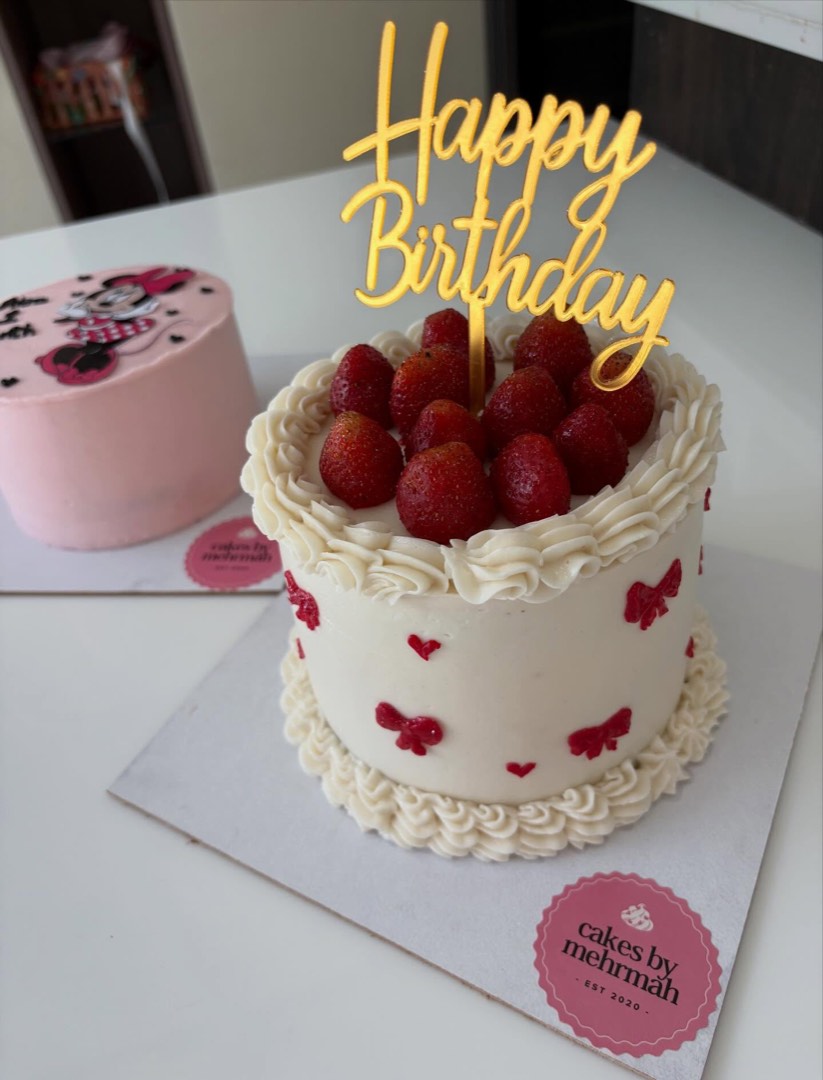 White cake crowned with fresh strawberries